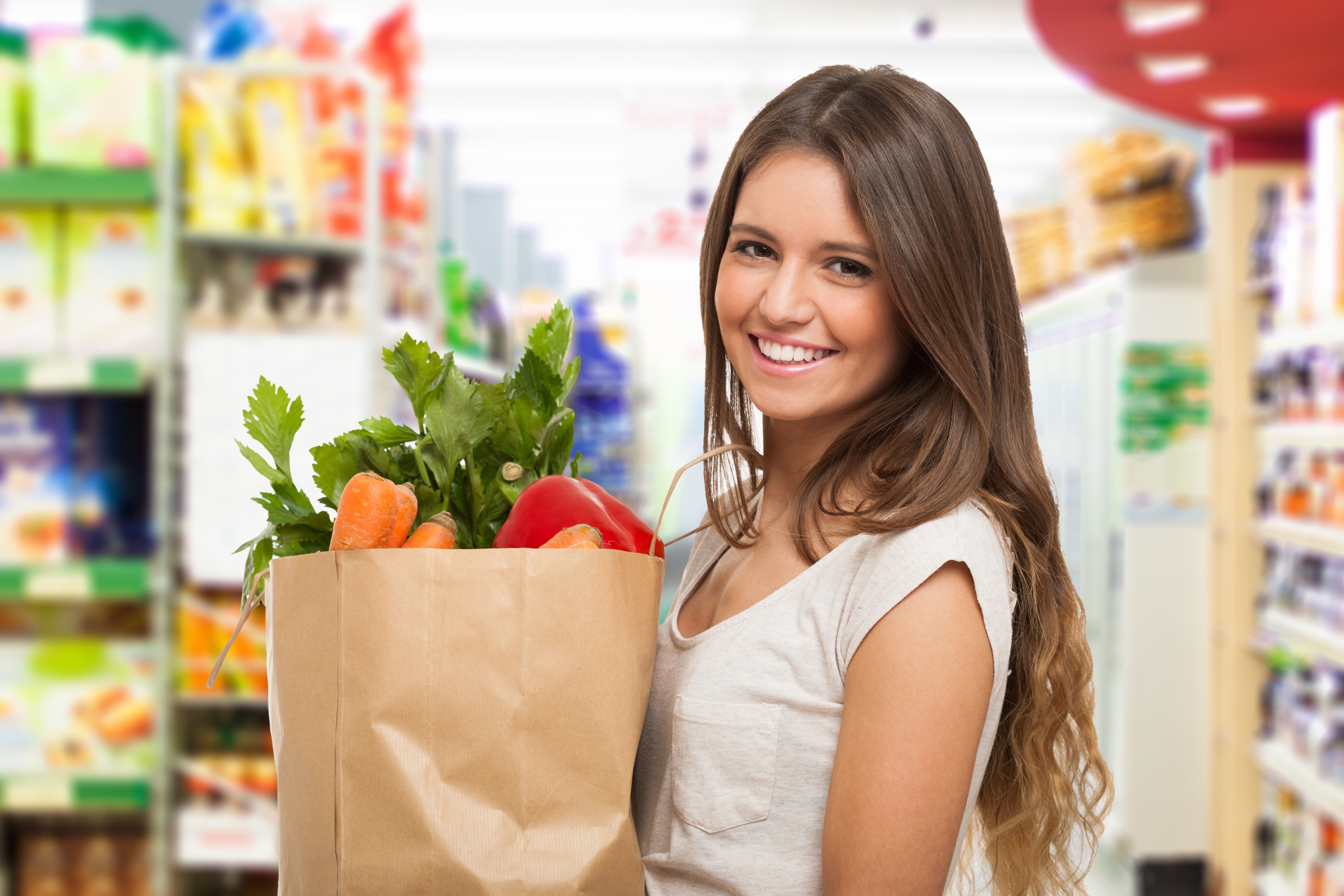 Woman holding a paper shopping bag